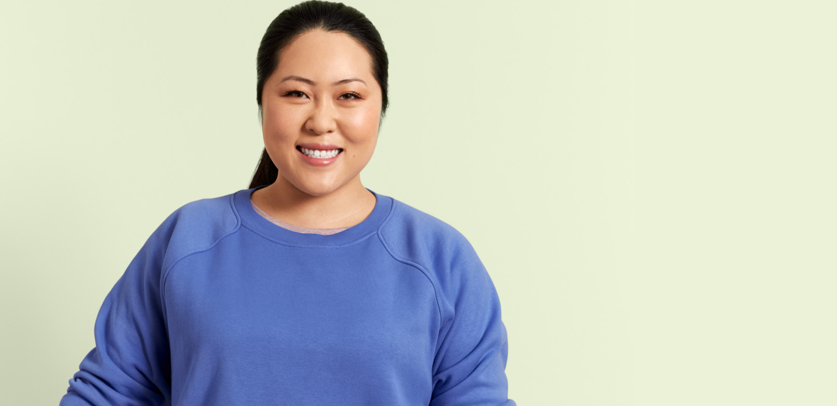 Girl smiling with green background