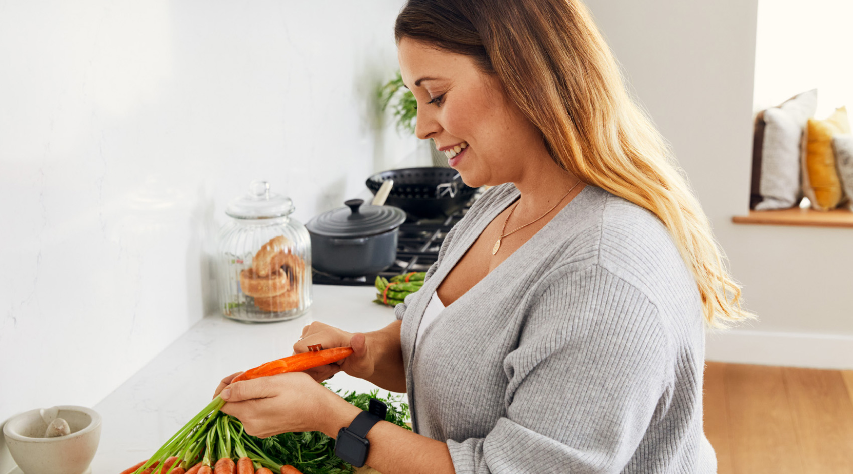 Woman peeling a carrot