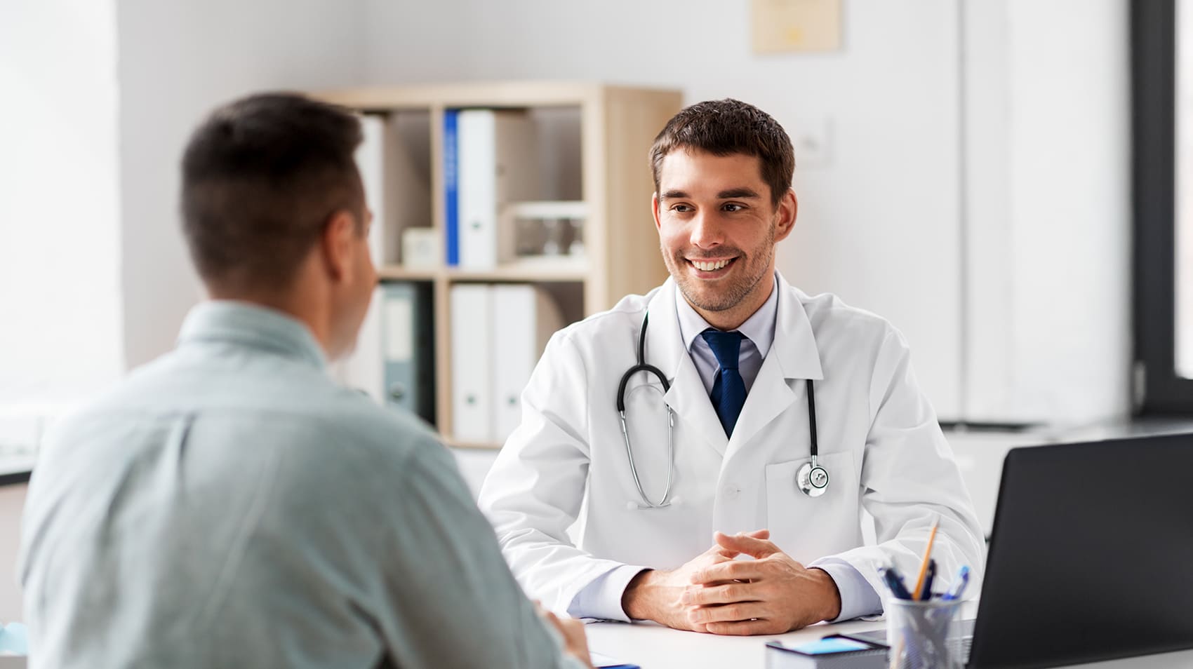 Doctor smiling at patient 