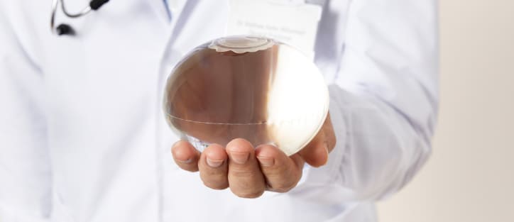 A Doctor holding the Allurion Gastric Balloon in his hands