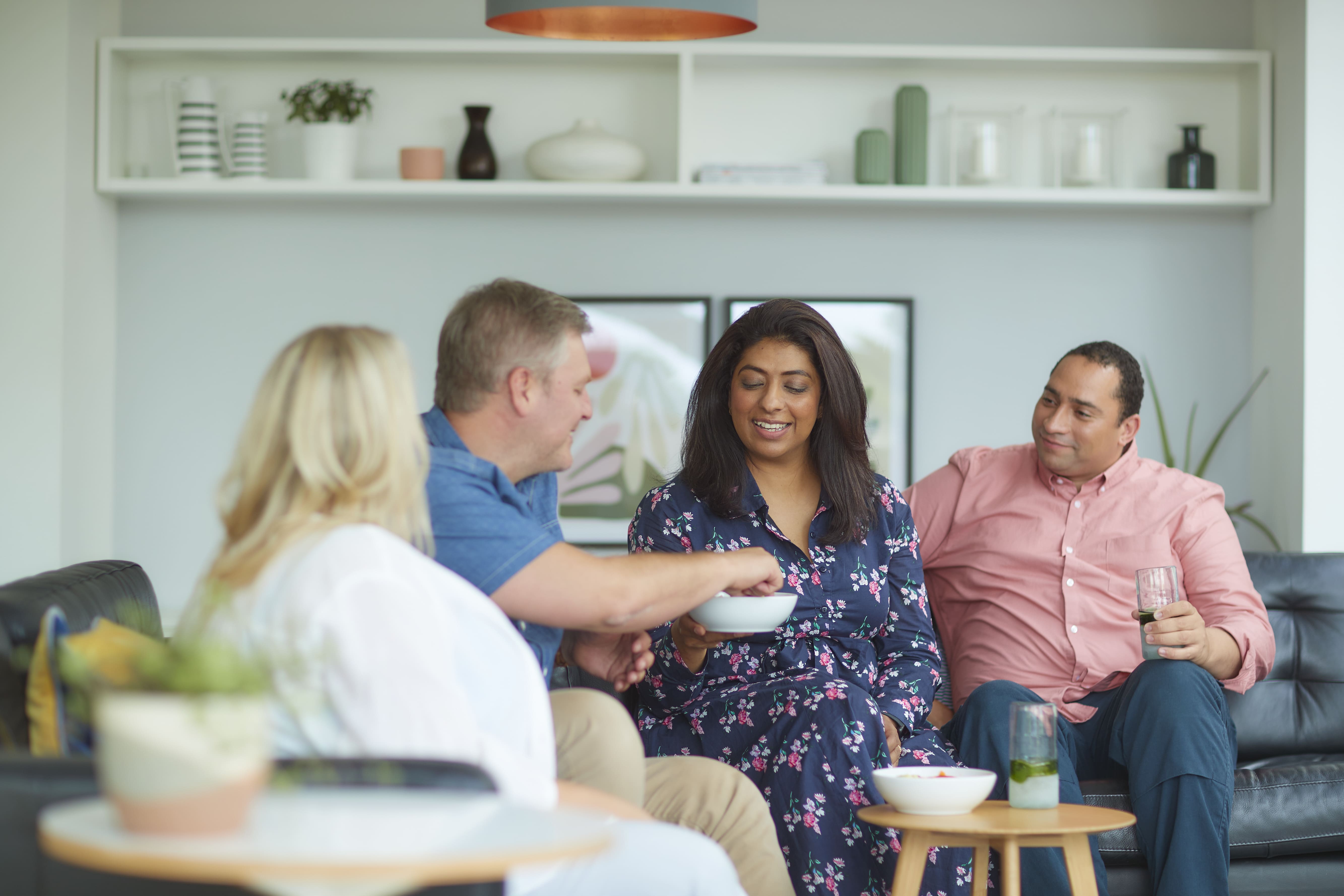 Group of friends talking about the Allurion programme