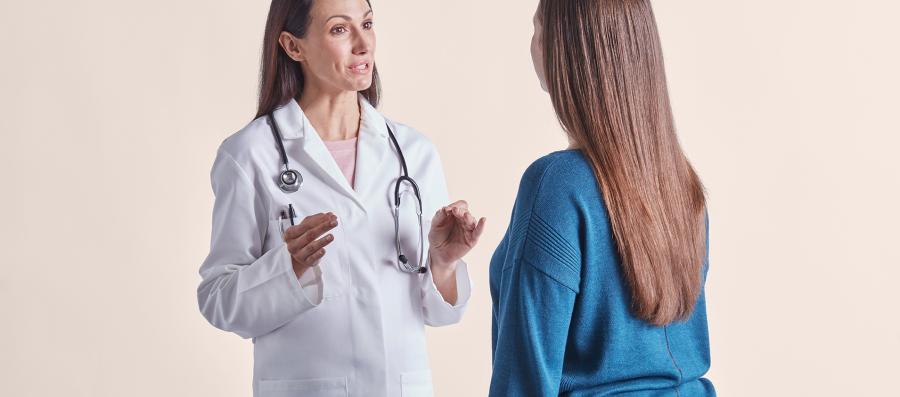 A doctor assisting her patient on her weight loss journey