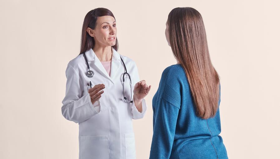 A doctor assisting her patient on her weight loss journey