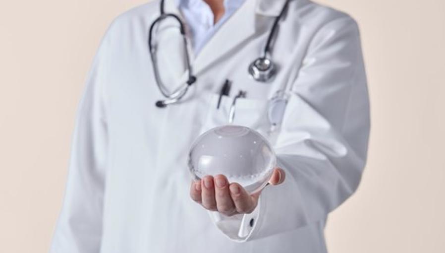 A Doctor holding the Allurion Gastric Balloon