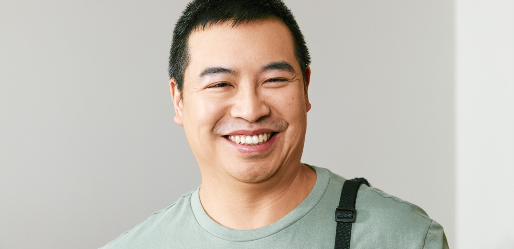 Guy Smiling - grey background