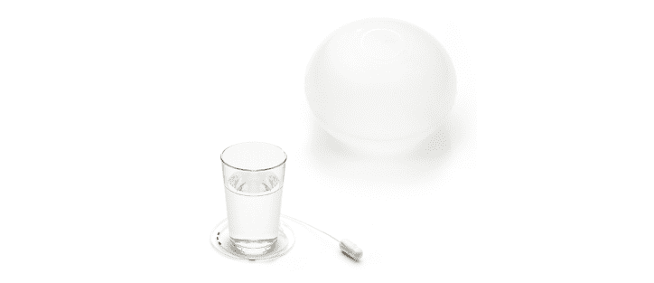 Gastric Balloon pill and a glass of water