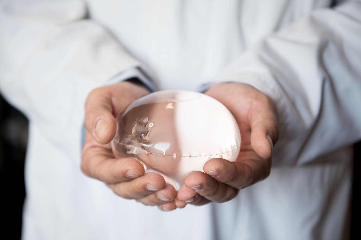 Doctor holding swallowable gastric balloon