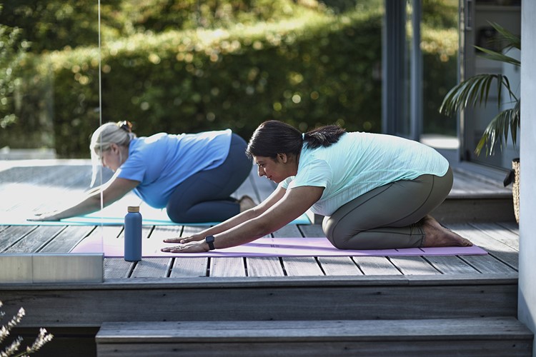 Two women doing Yoga exercises 